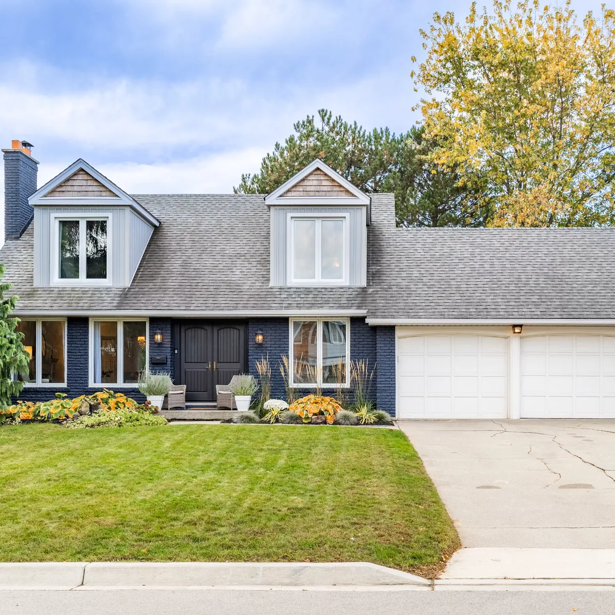 Detached suburban home with landscaped front yard
