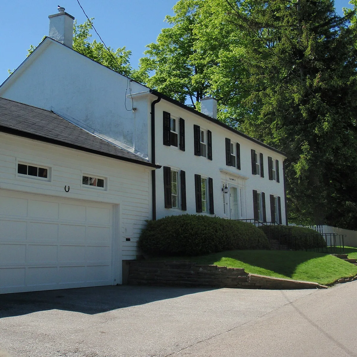 Established detached home surrounded by mature trees in Oakville