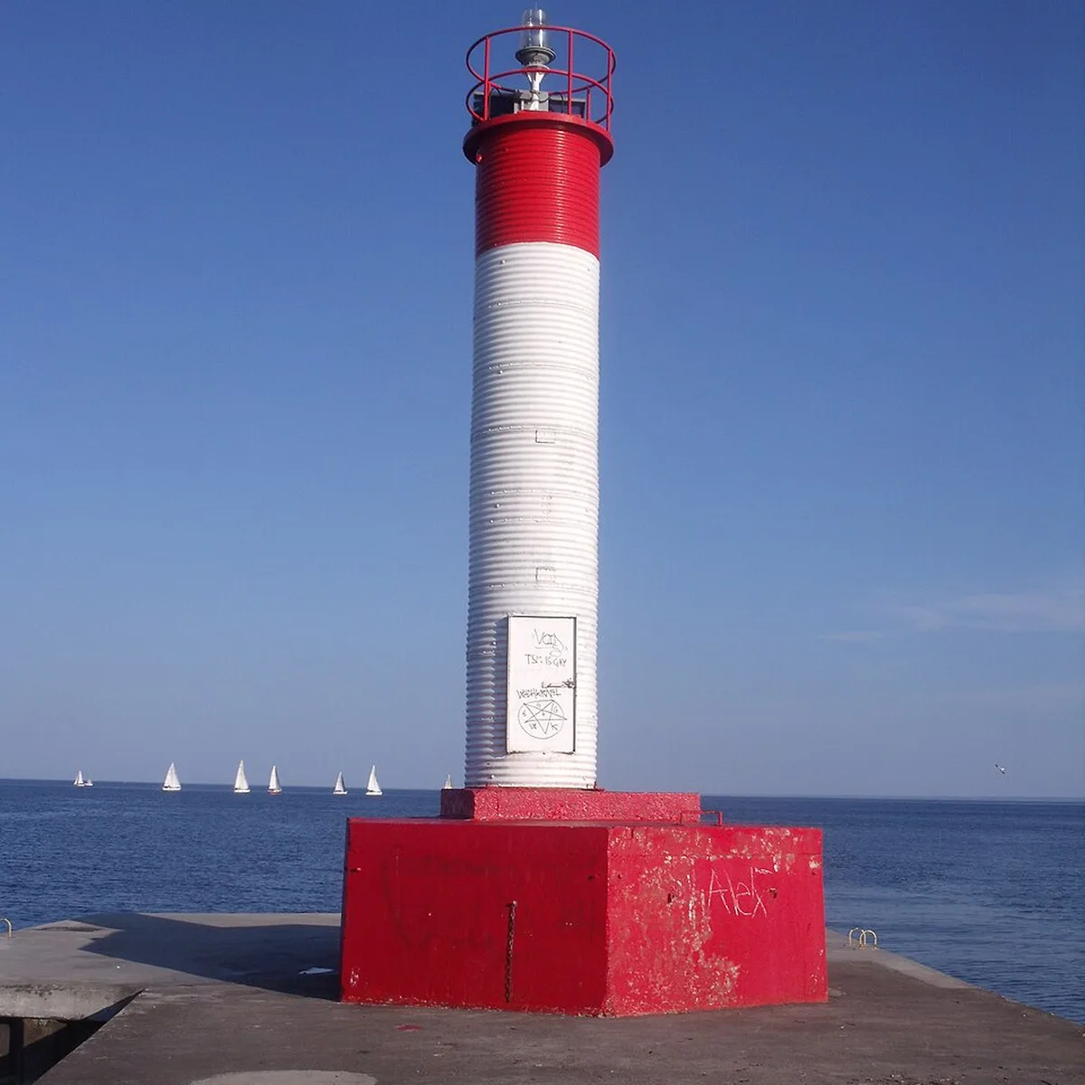 Red and white lighthouse at Oakville Harbour in Old Oakville