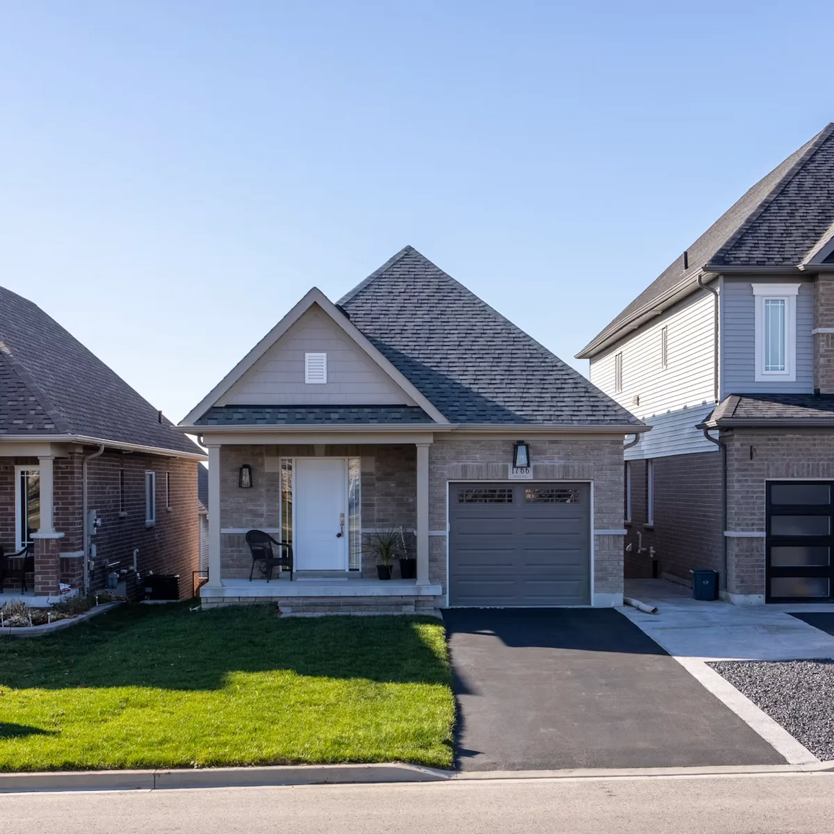 Modern detached family home with garage and landscaped front yard